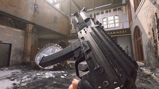 The player in Warzone 2.0 inspects their weapon, the Vaznev-9k.