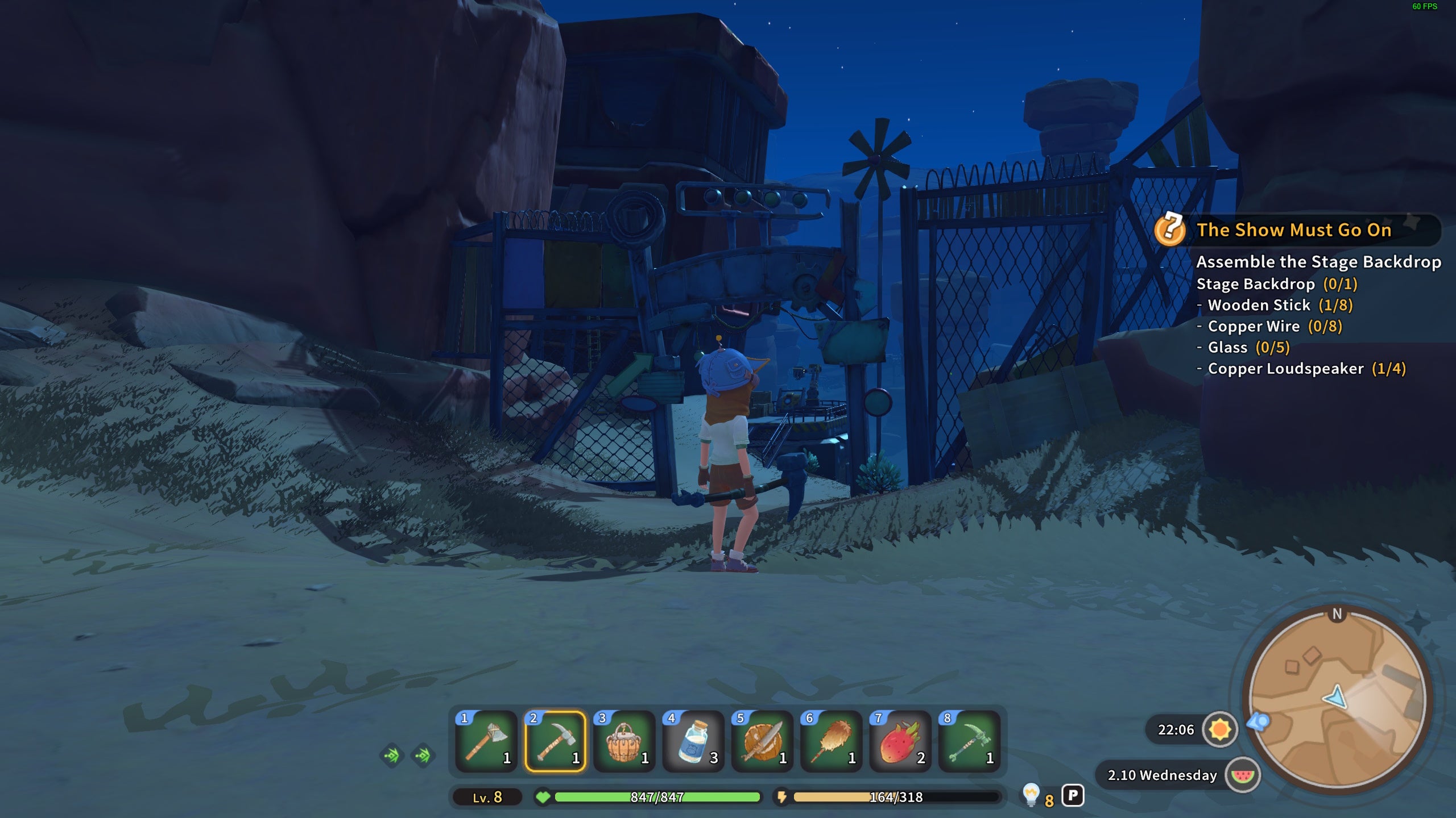 My Time at Sandrock aluminum scraps: An animated young man stands outside a scrapyard in the middle of a barren valley