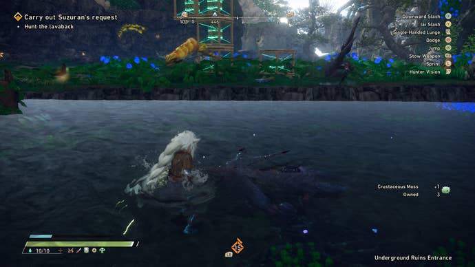 A hunter collecting Crustaceous Moss from a giant crab in Wild Hearts