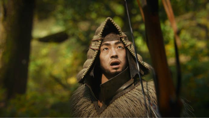 A hunter in Wild Hearts wielding a bow looks up with a shocked face at something off-screen.