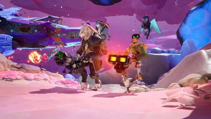 A group of four sci-fi characters, three of them anthropomorphic aliens, one a robot, are charging forward with guns in hand on some kind of alien, rocky place in Wildgate.