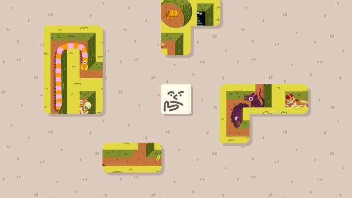 Wilmot ponders a few puzzle pieces with a quizzical expression.