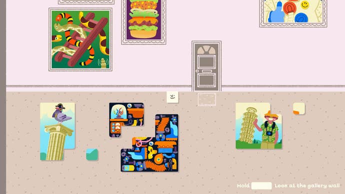 Wilmot stands over three nearly complete puzzles in his hallway.