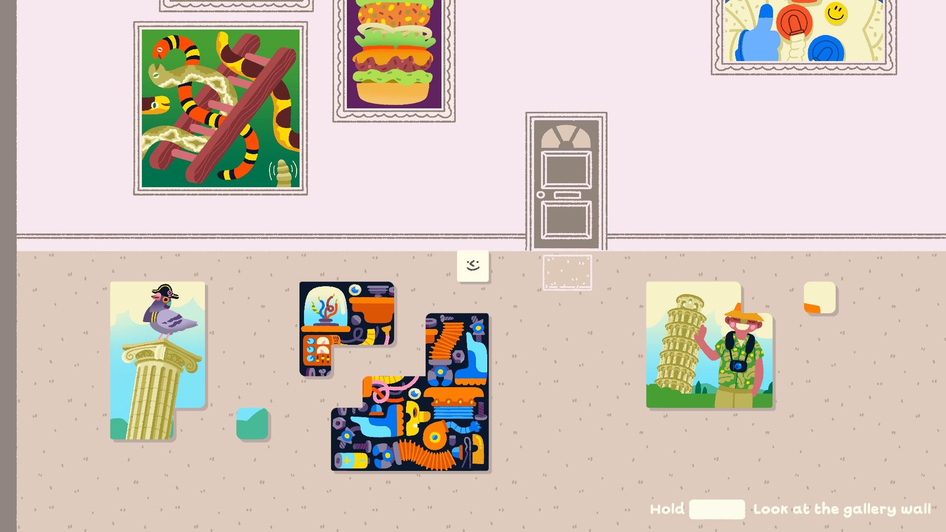 Wilmot stands over three nearly complete puzzles in his hallway. - 1