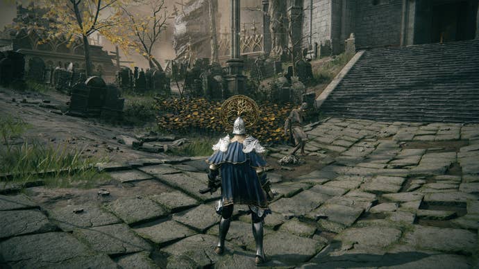 Gostoc stomping on Godrick’s remains in Elden Ring.