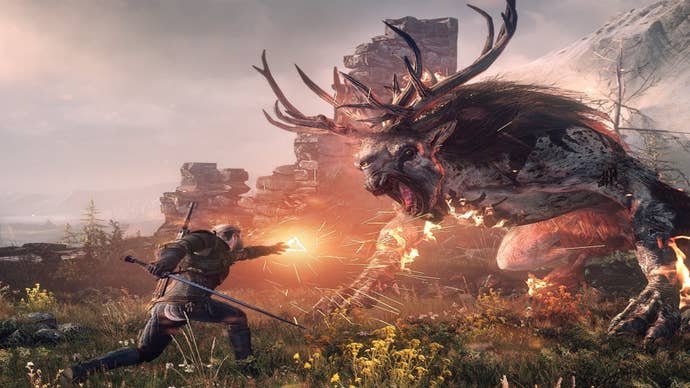 The Witcher 3 best abilities: A man wearing chain mail is casting fire from his hand toward a giant grey monster with deer antlers