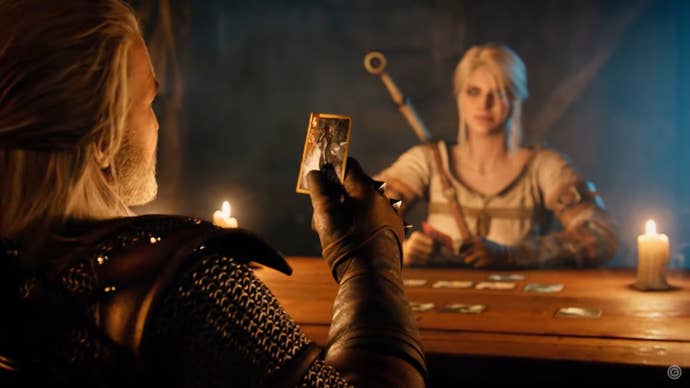 Geralt holds a card in front of him as Ciri faces him across a table in a candlelit inn.