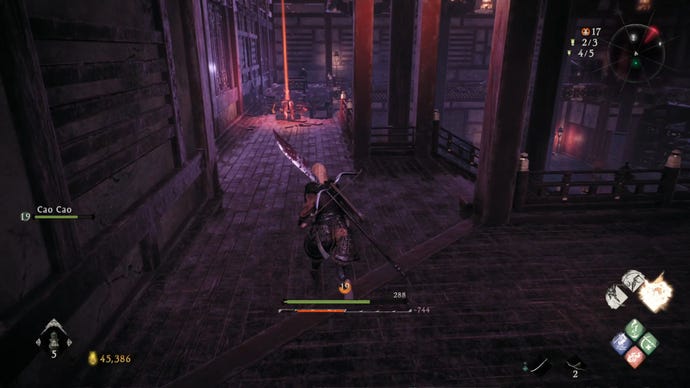 A Wo Long: Fallen Dynasty screenshot of the player standing next to a flag.