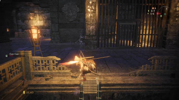 A Wo Long: Fallen Dynasty screenshot of the player standing next to a flag.