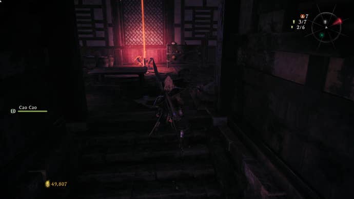 A Wo Long: Fallen Dynasty screenshot of the player standing next to a flag.