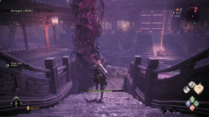 A Wo Long: Fallen Dynasty screenshot of the player standing next to a flag.