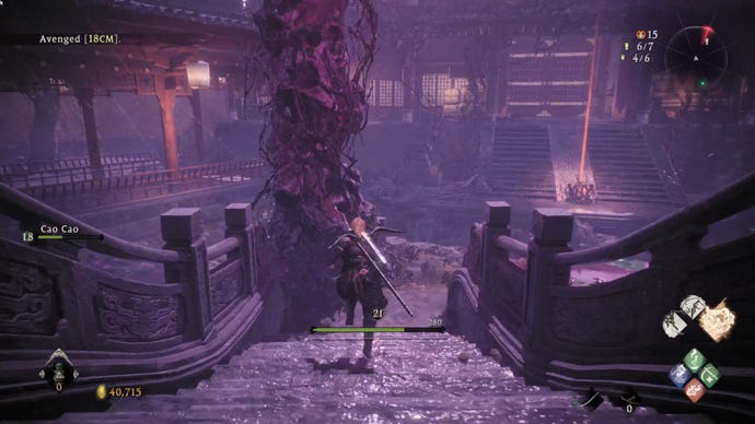 A Wo Long: Fallen Dynasty screenshot of the player standing next to a flag.