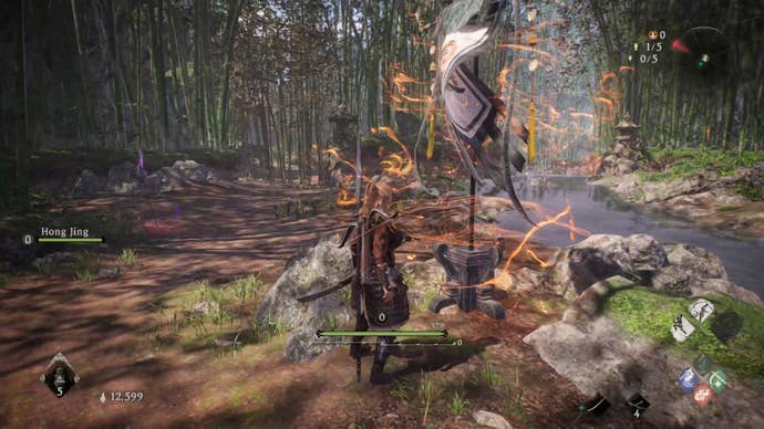 A Wo Long: Fallen Dynasty screenshot of the player standing next to a flag.