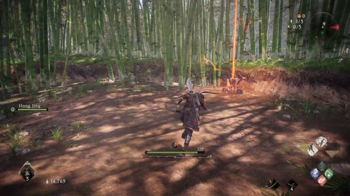 A Wo Long: Fallen Dynasty screenshot of the player standing next to a flag.