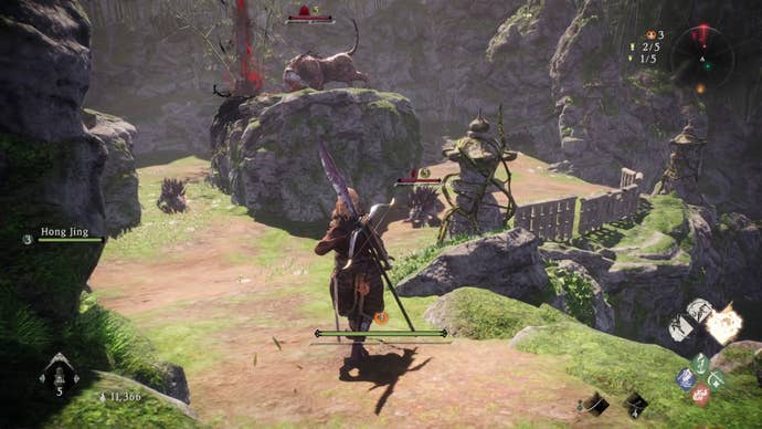 A Wo Long: Fallen Dynasty screenshot of the player standing next to a flag.