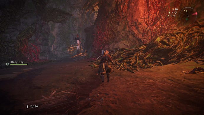 A Wo Long: Fallen Dynasty screenshot of the player standing next to a flag.