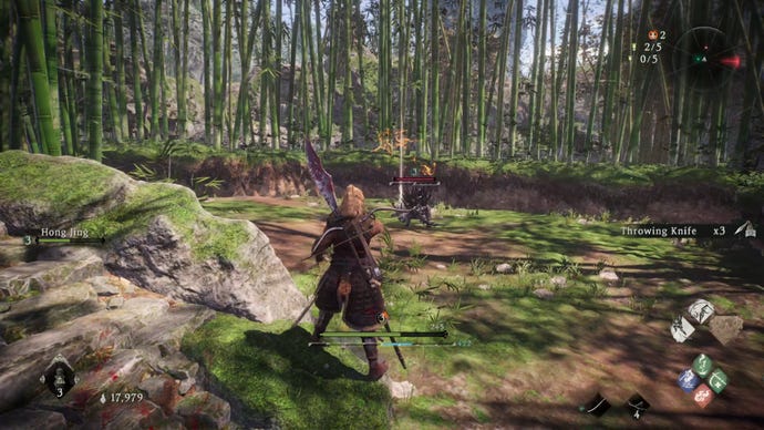 A Wo Long: Fallen Dynasty screenshot of the player standing next to a flag.