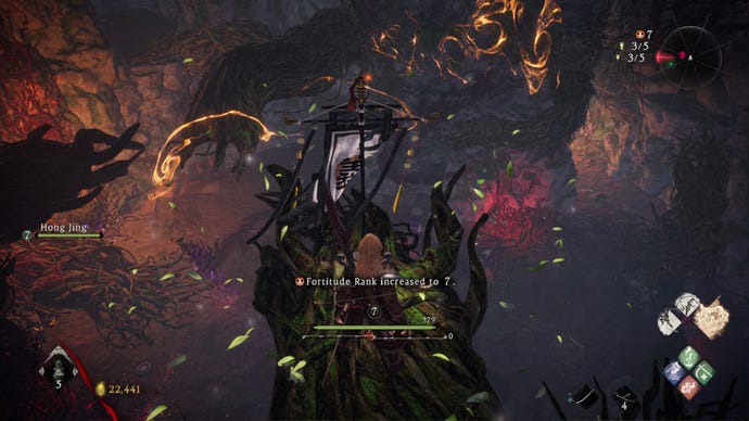 A Wo Long: Fallen Dynasty screenshot of the player standing next to a flag.