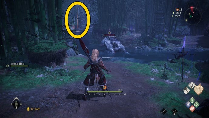 A Wo Long: Fallen Dynasty screenshot of the player standing next to a flag.