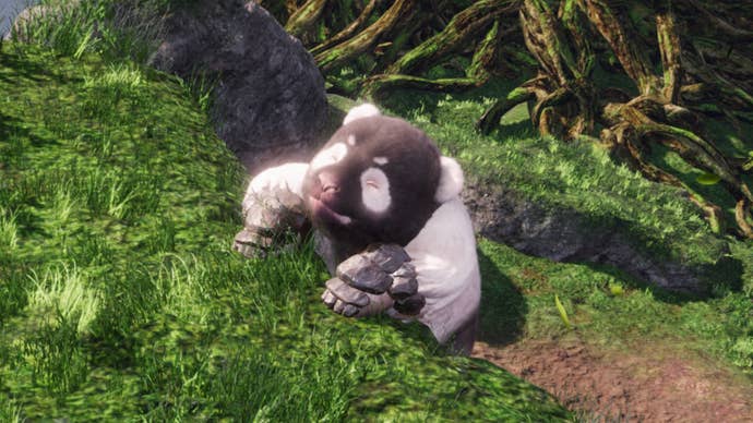 A Shitieshou demon in Wo Long struggles to haul itself up a ledge in a bamboo forest.