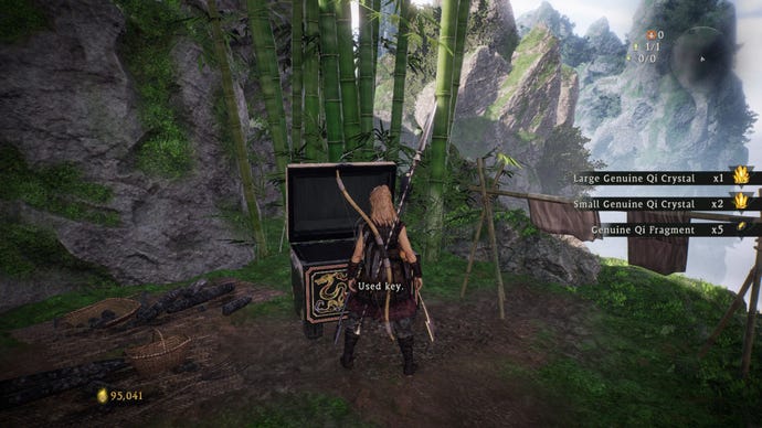 The player in Wo Long: Fallen Dynasty opens one of the chests outside the Taoist’s House in the Village.