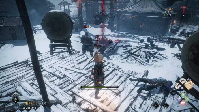 A Wo Long: Fallen Dynasty screenshot of the player standing next to a flag.