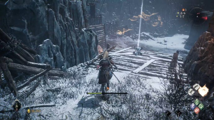 A Wo Long: Fallen Dynasty screenshot of the player standing next to a flag.