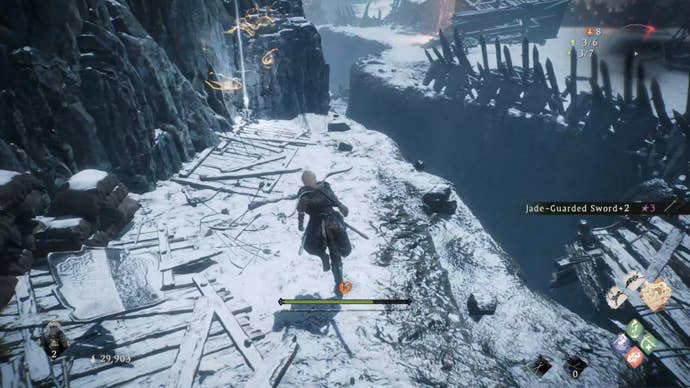 A Wo Long: Fallen Dynasty screenshot of the player standing next to a flag.