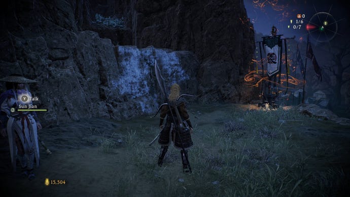 A Wo Long: Fallen Dynasty screenshot of the player standing next to a flag.