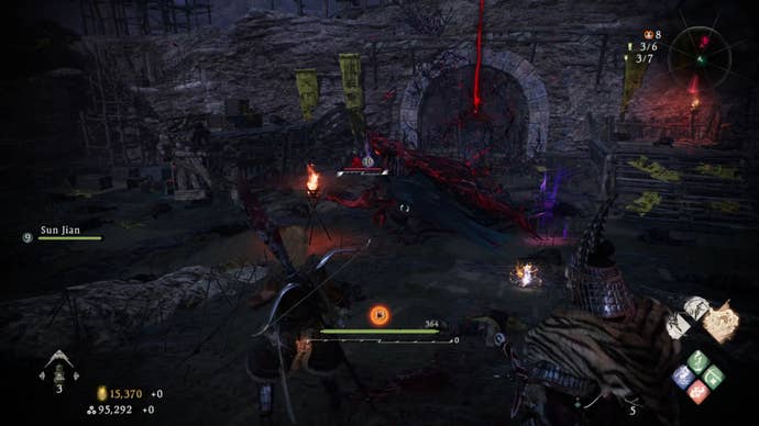 A Wo Long: Fallen Dynasty screenshot of the player standing next to a flag.