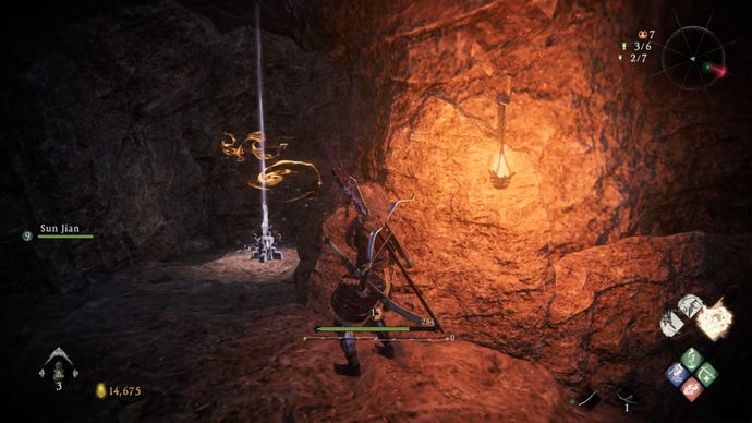 A Wo Long: Fallen Dynasty screenshot of the player standing next to a flag.