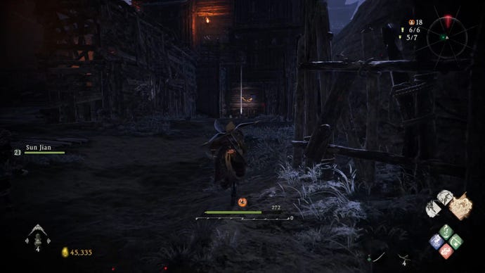 A Wo Long: Fallen Dynasty screenshot of the player standing next to a flag.