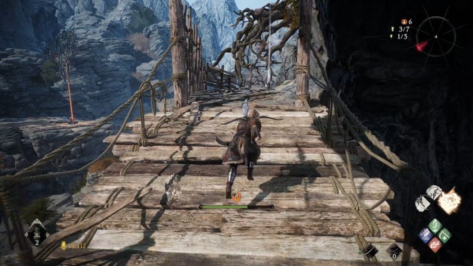 A Wo Long: Fallen Dynasty screenshot of the player standing next to a flag.