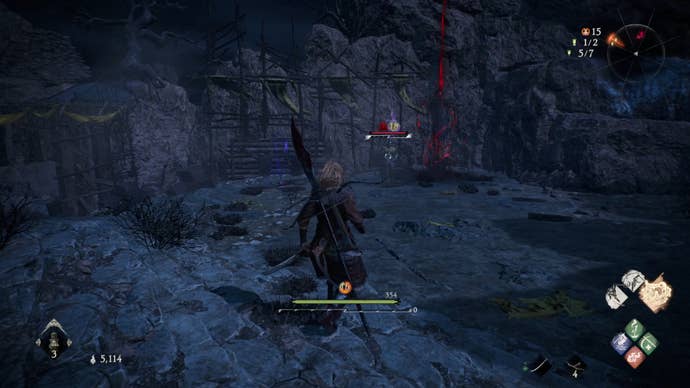 A Wo Long: Fallen Dynasty screenshot of the player standing next to a flag.