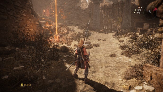 A Wo Long: Fallen Dynasty screenshot of the player standing next to a flag.