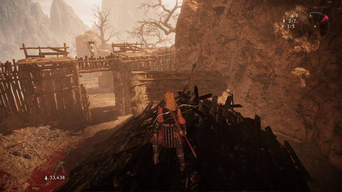 A Wo Long: Fallen Dynasty screenshot of the player standing next to a flag.