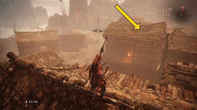 A Wo Long: Fallen Dynasty screenshot of the player standing next to a flag.