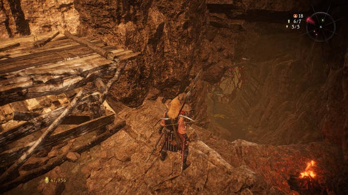 A Wo Long: Fallen Dynasty screenshot of the player standing next to a flag.