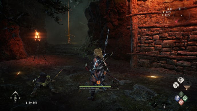 A Wo Long: Fallen Dynasty screenshot of the player standing next to a flag.