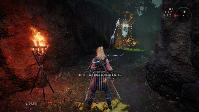 A Wo Long: Fallen Dynasty screenshot of the player standing next to a flag.