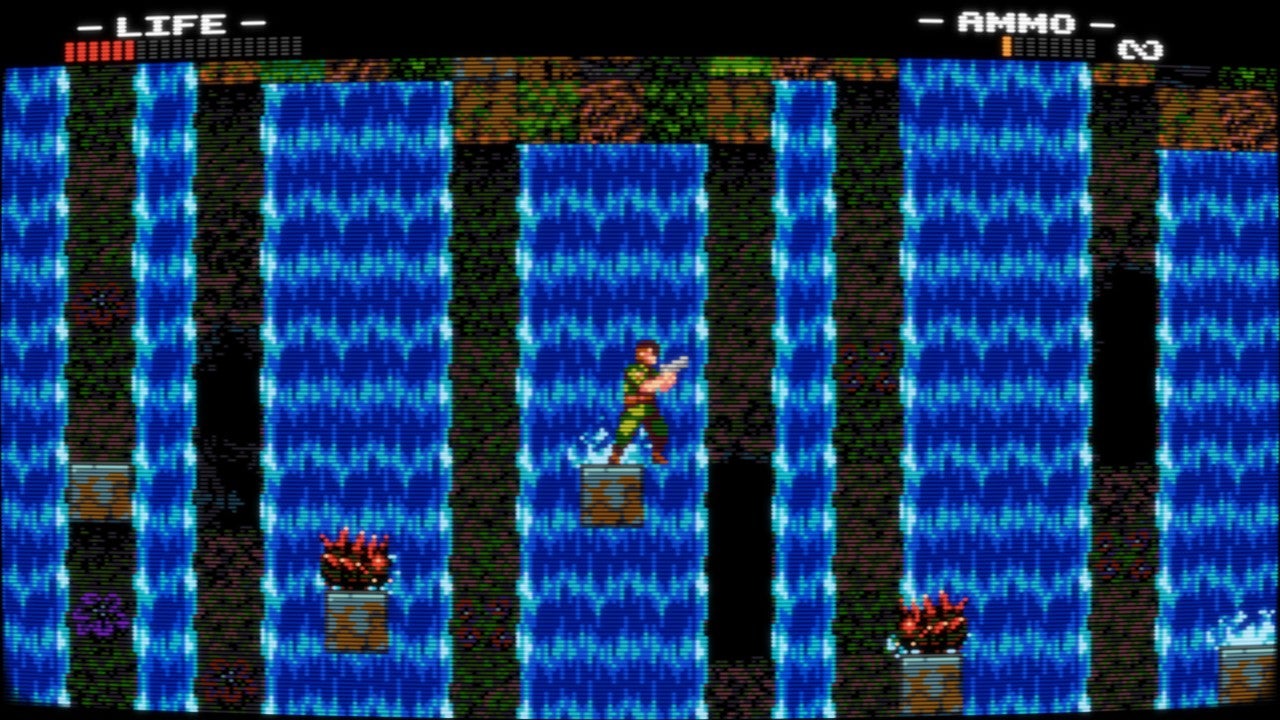 Chuck Rosetti stands on a tiny platform with a huge waterfall raging behind him. On the ledges by the waterfall are tiny crab-like enemies which will surely knock him off.