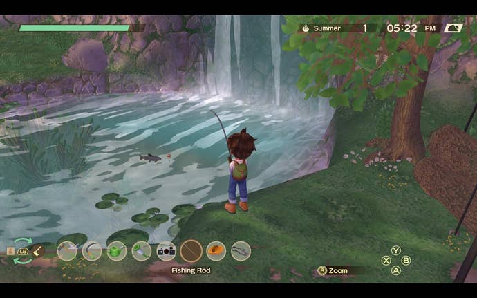 A farmer fishes beneath a waterfall