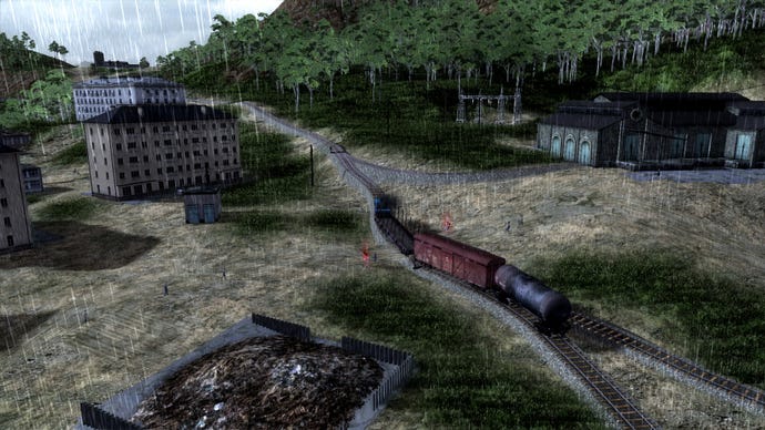 A train ambles through a rainy town in Workers and Resources: Soviet Republic.