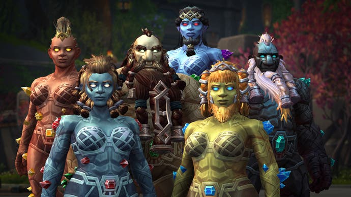 A screenshot showing several multi-coloured Earthen dwarves from the new World of Warcraft expansion The War Within. They all stand next to each other and stare at the camera. It's quite disconcerting.