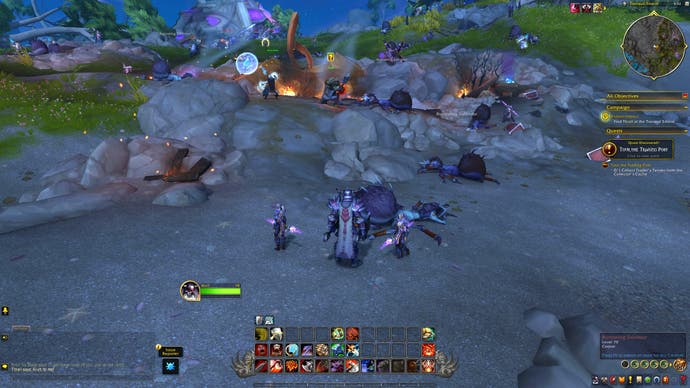 A World of Warcraft screenshot showing a rocky costal area littered with the corpses of giant spider people. Blame Bertie - he killed them all.