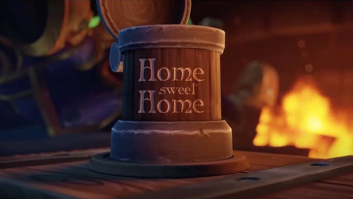 A screenshot from World of Warcraft’s player housing teaser trailer showing a wooden tankard on a table in front of a roaring log fire. “Home Sweet Home”, has been carved into the tankard.