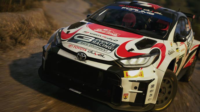A Toyota rally car turns successful the mud successful WRC.