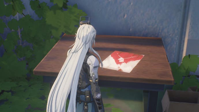Calcharo screaming waves facing a red white flyer on table