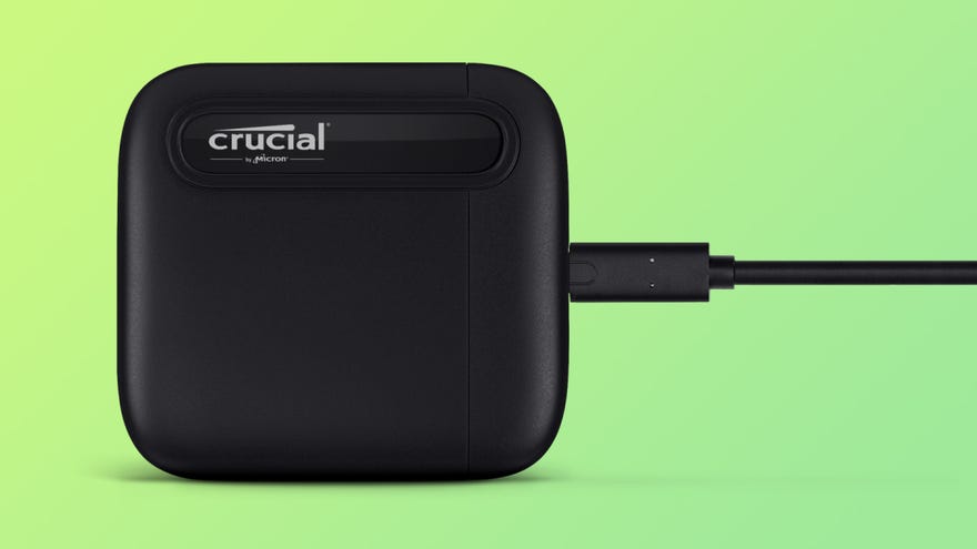 a crucial x6 portable ssd, shown on a coloured background