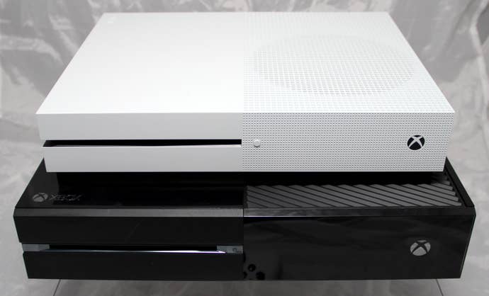 The Xbox One S stacked above the bigger, blacker, bulkier Xbox One console.